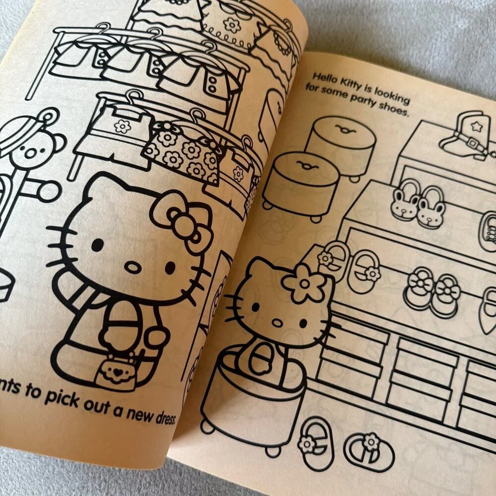 2009 New‎ NOS Sanrio Hello Kitty coloring activity book/paper doll